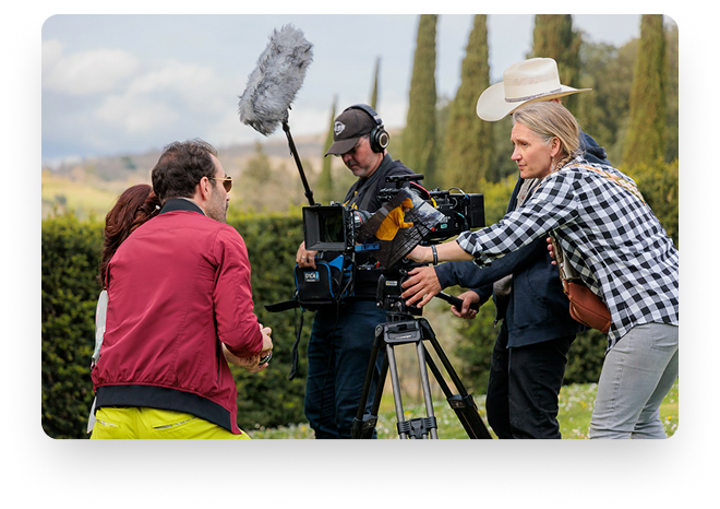 Debra Pralle collaborating with a film crew on set